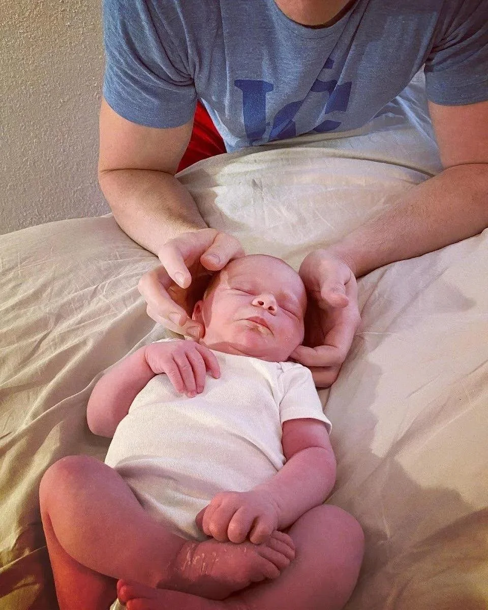 Newborn baby close-up during tongue tie symptoms assessment