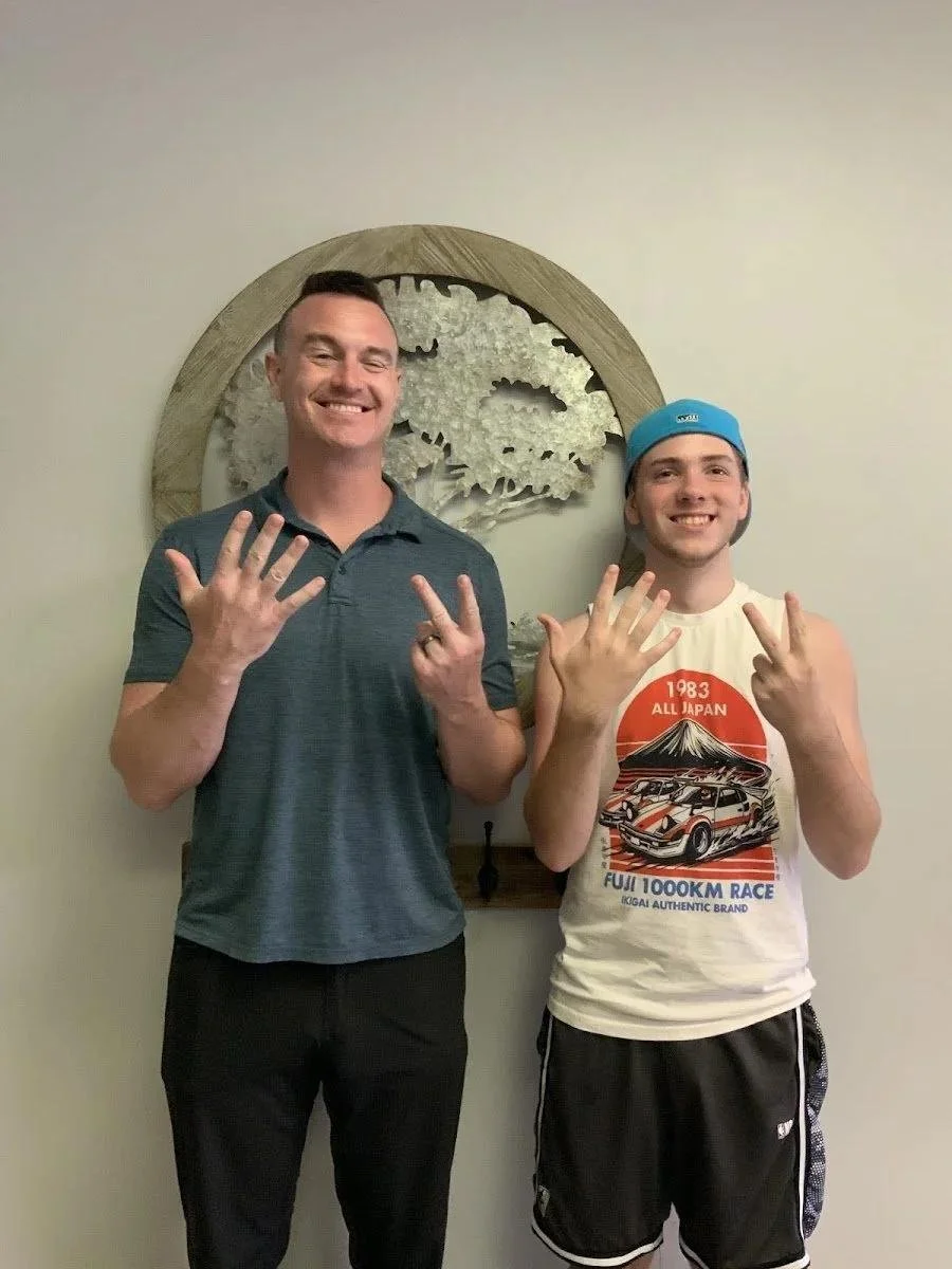 Dr and athlete's celebrating sports chiropractic results