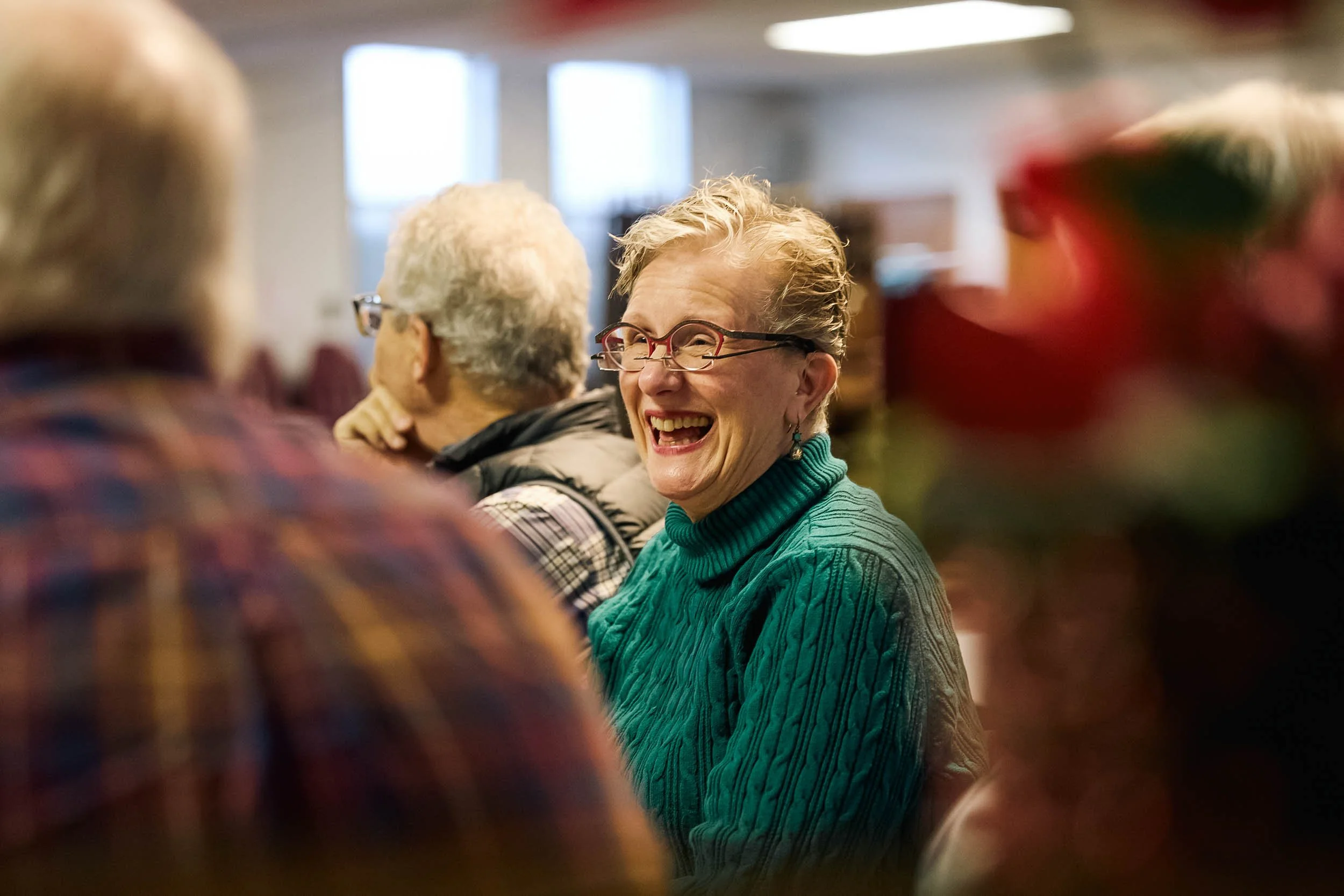 A woman laughs and engages with her small group at Crown Hill Church in Seattle's Crown Hill neighborhood.