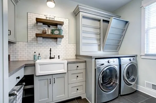 Laundry room with washer and dryer, white cabinets, a farmhouse sink, and open shelves above the sink and appliances.