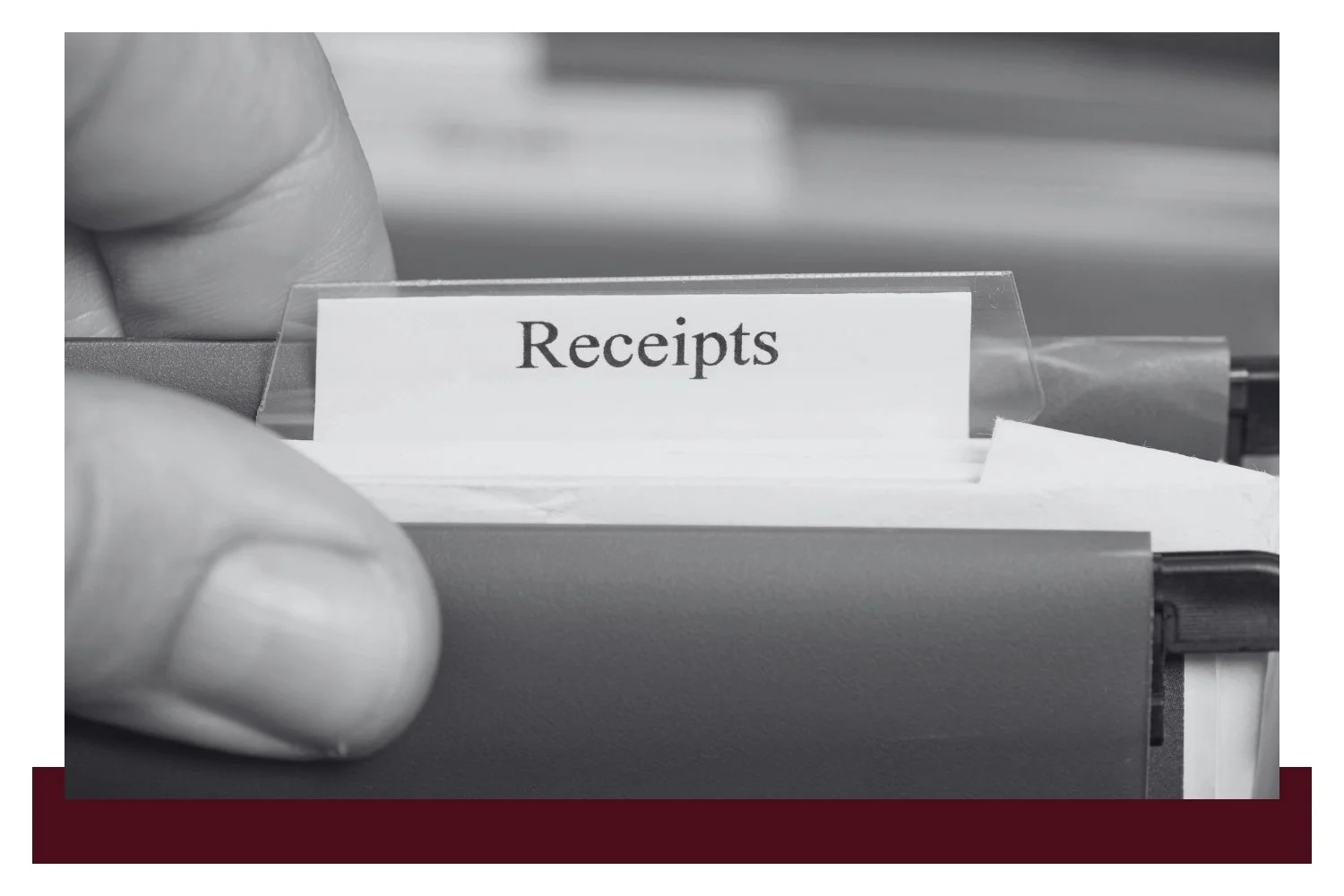 Close-up of a hand holding a paper slip labeled “Receipts” inside a filing or stamping device.