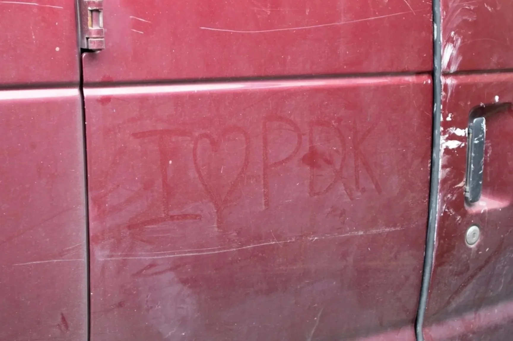 A vehicle at a construction site with 'I love PDK' written on it, showcasing the positive team culture and brand loyalty of PDK Construction.