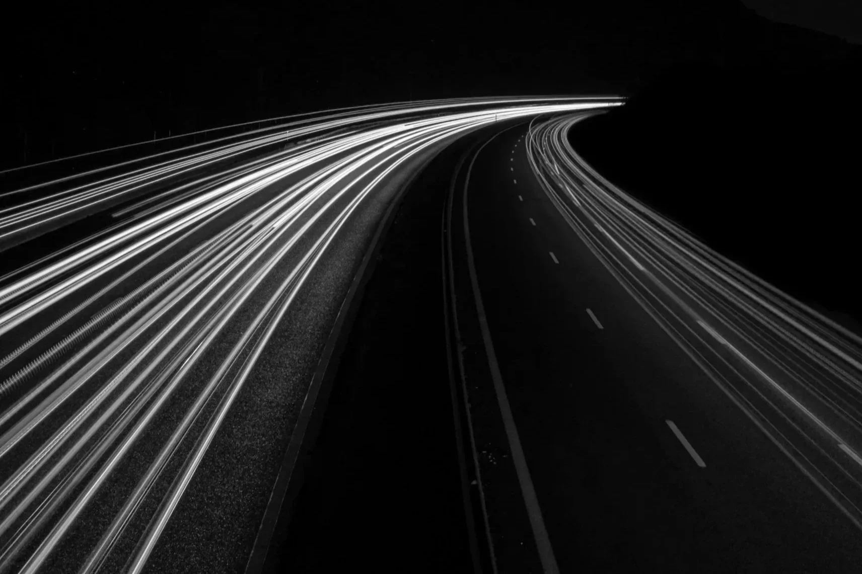 Long exposure photo of road lines symbolizing efficient design and construction scheduling and project timeline.