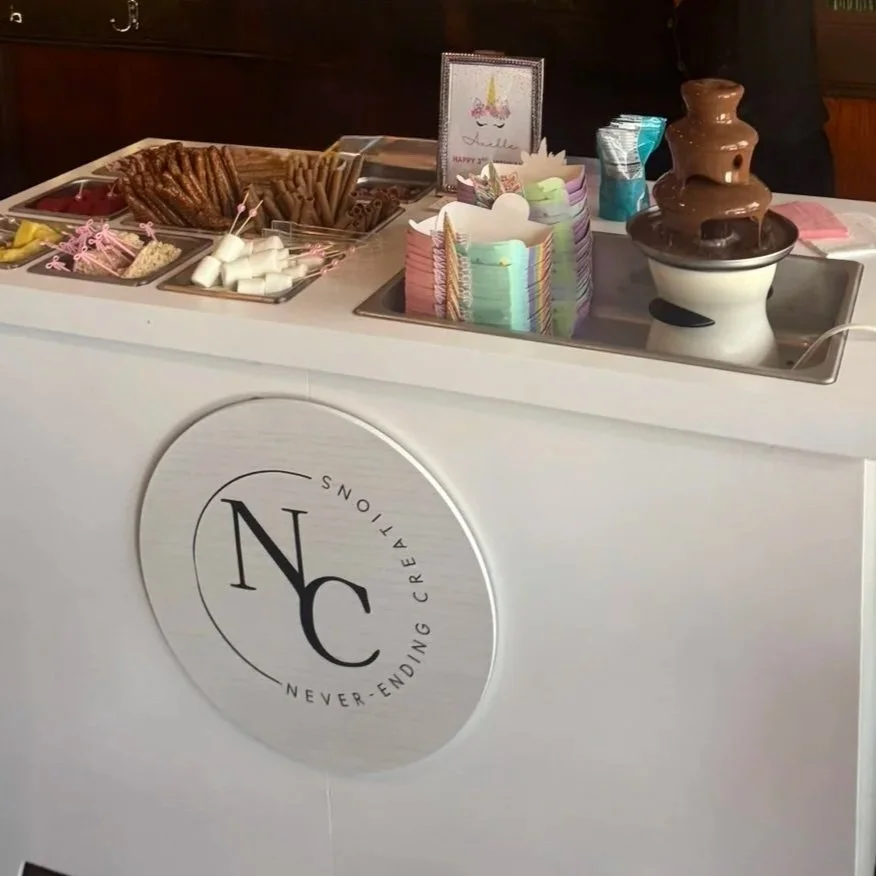 Decadent chocolate fountain dessert station.