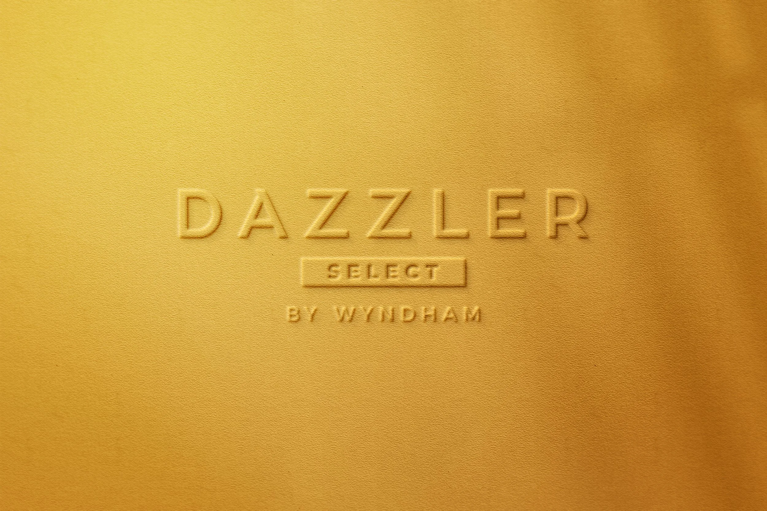 Etiqueta dorada con el texto 'Dazzler Select by W Yemen' en relieve.