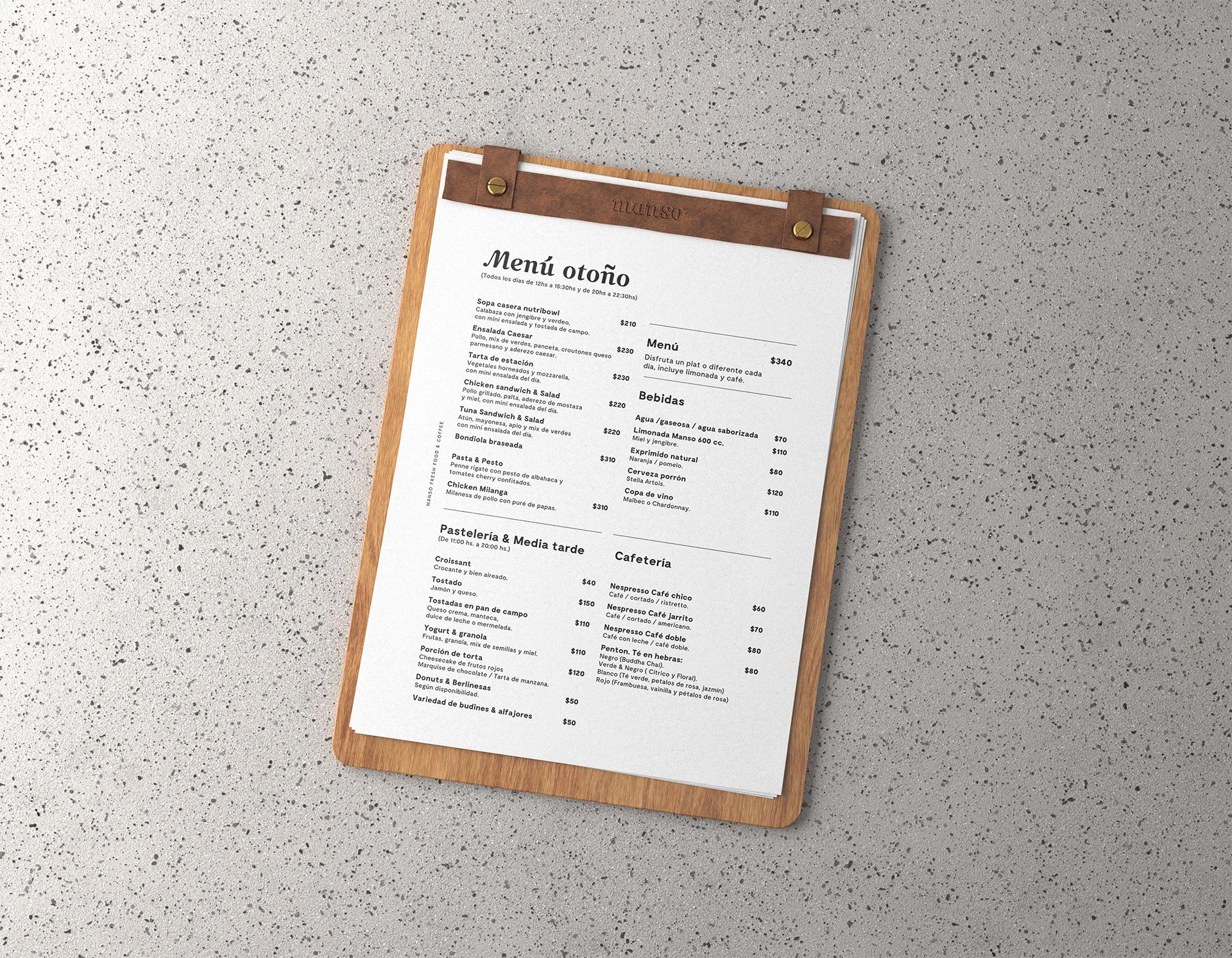 Menú de comida en una hoja sobre una tabla de madera, con diferentes categorías y precios.