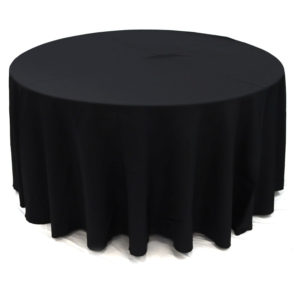 Round black table covered with a black tablecloth.