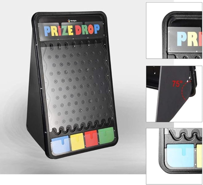 A prize drop game with a vertical playing surface, colorful letters at the top spelling 'PRIZE DROP', and four colored compartments at the bottom in blue, yellow, red, and green. The game platform is angled at 75 degrees.