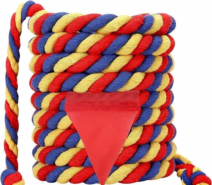 Colorful braided ropes in red, yellow, and blue stacked with a red triangular flag attached to the front.