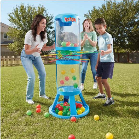 Children playing a ball toss game called Kerplunk in a backyard.