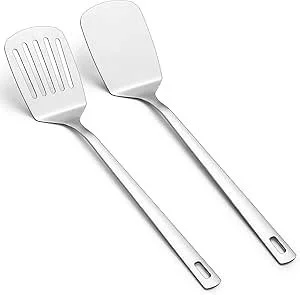 Two metal spatulas, one with a slotted design and the other solid, with long handles.
