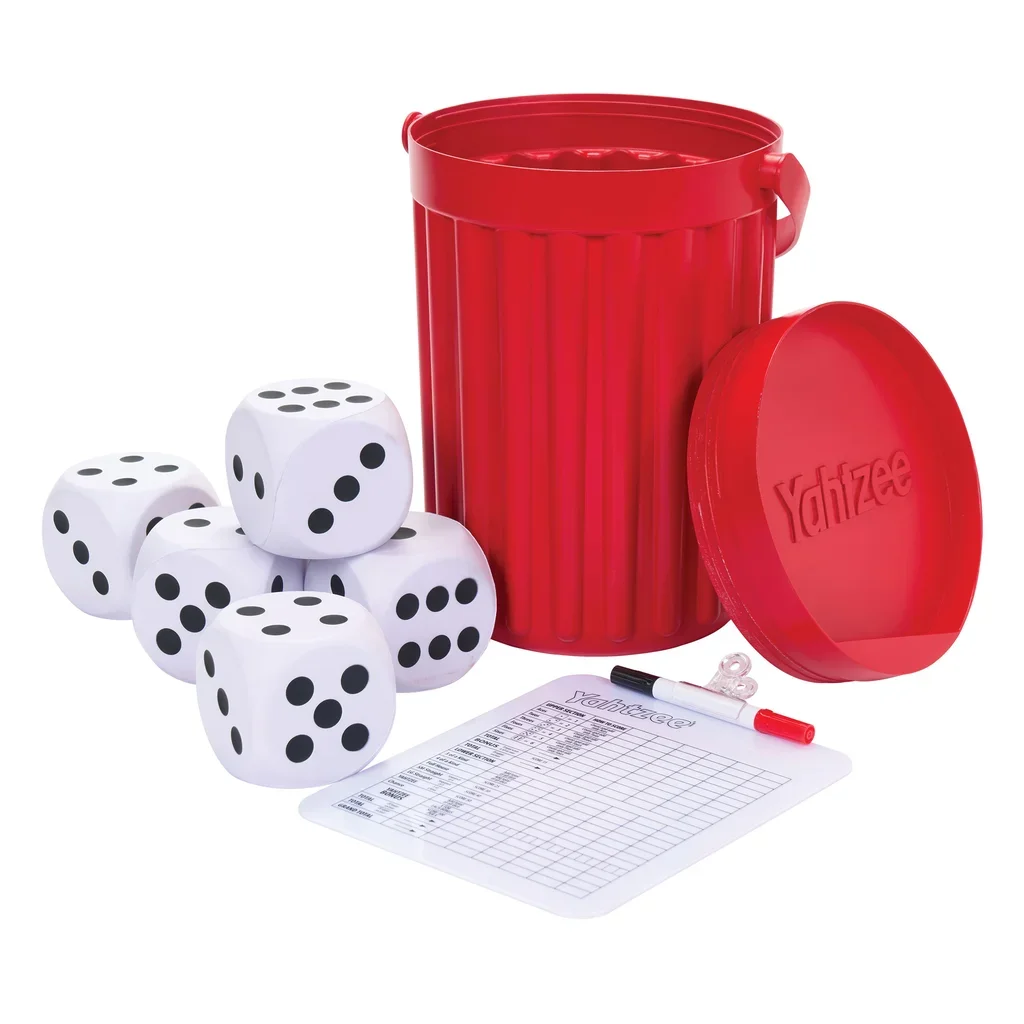 Board game on white background, including five white dice with black dots, a red cylindrical storage container with a detachable lid, a score sheet, a black marker with red tip, and transparent game pieces.