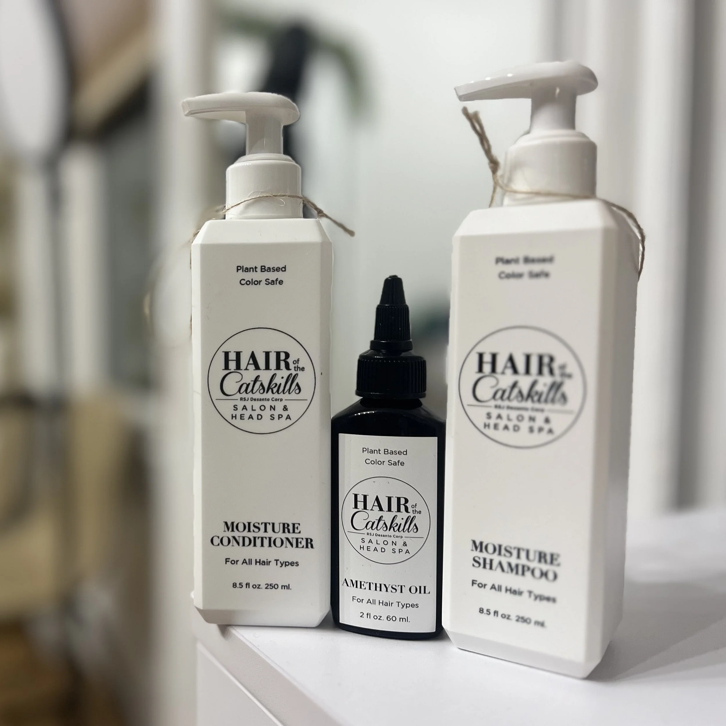 bottles of hair product featuring Hair of the Catskills logo