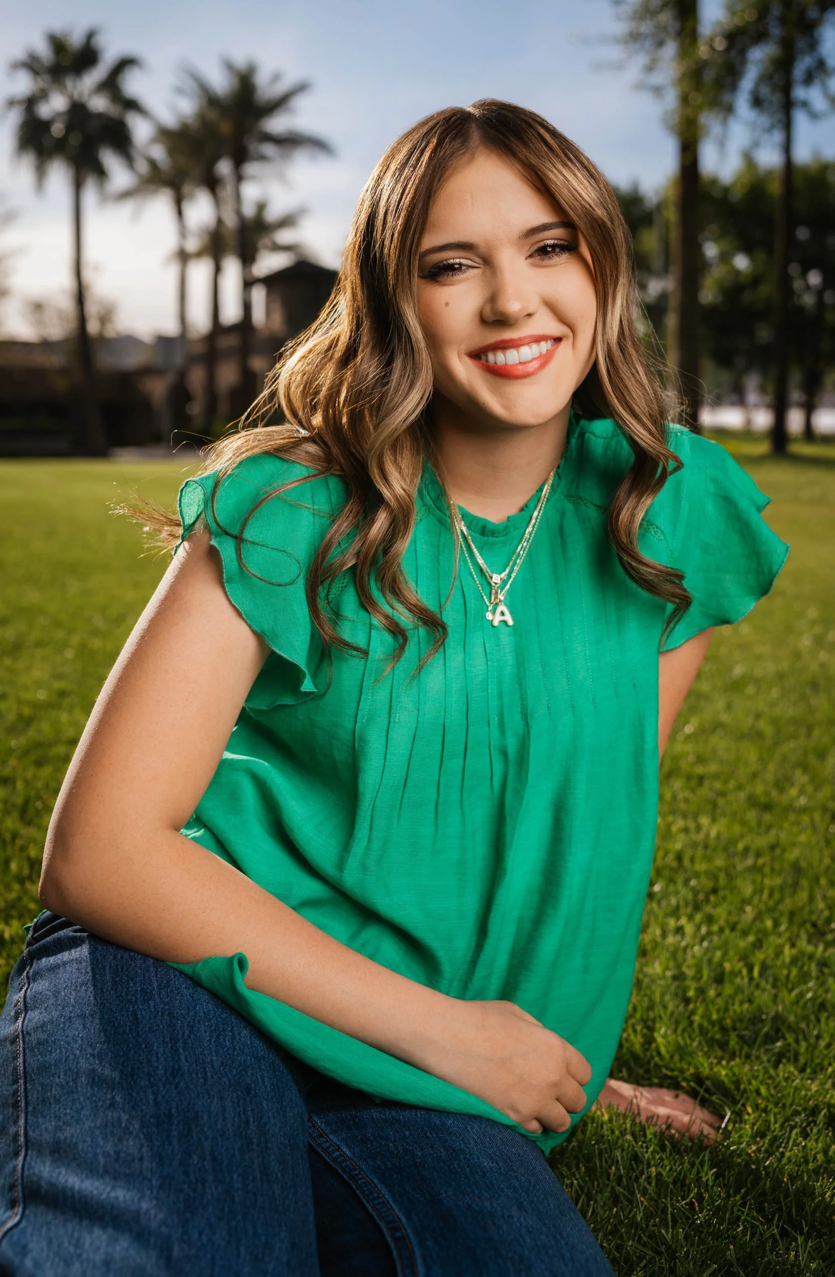 senior girl in Phoenix sitting in grass