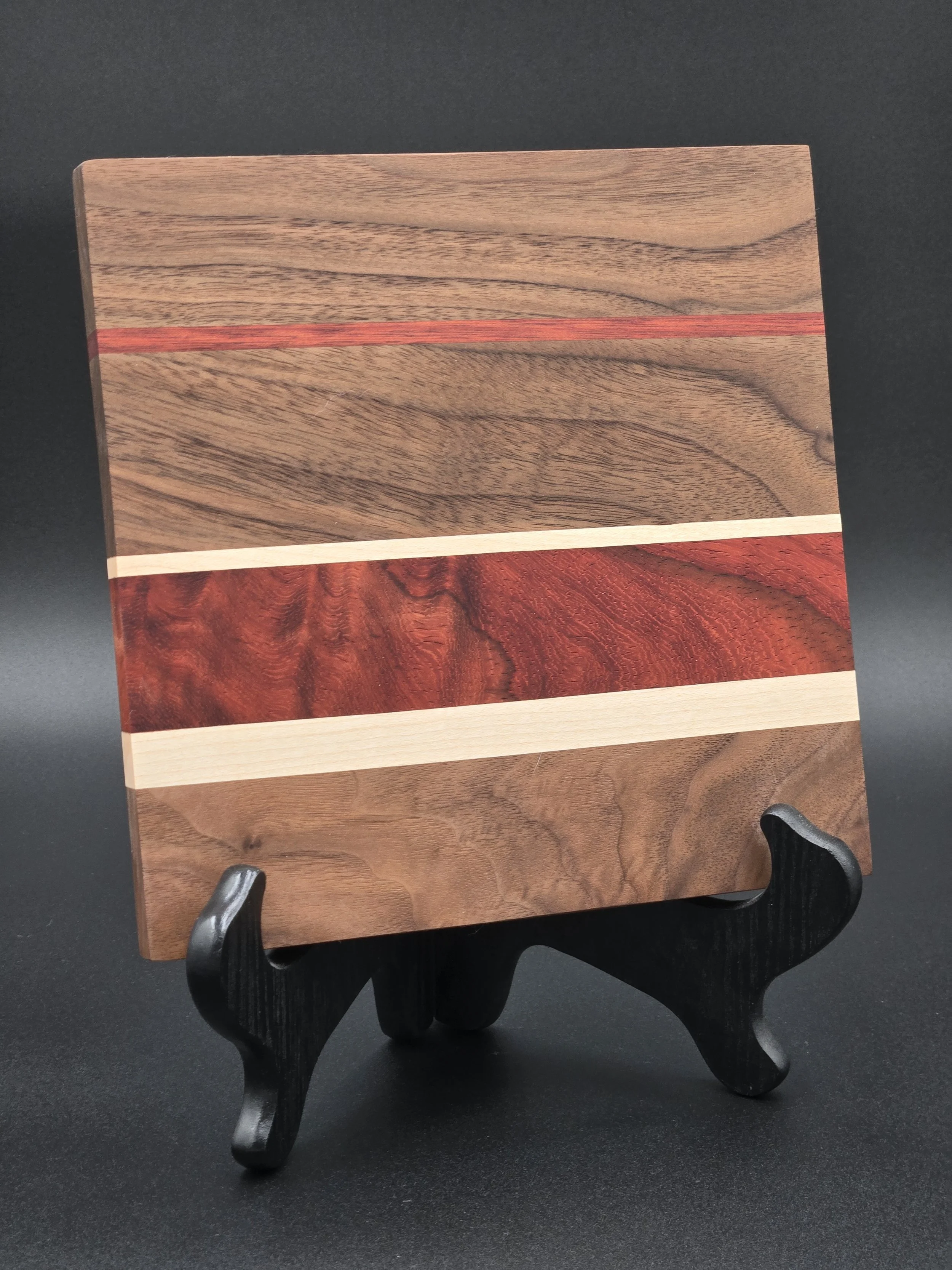 	
Custom cutting boards with various species of hard woods and all sealed with all-natural board butter.