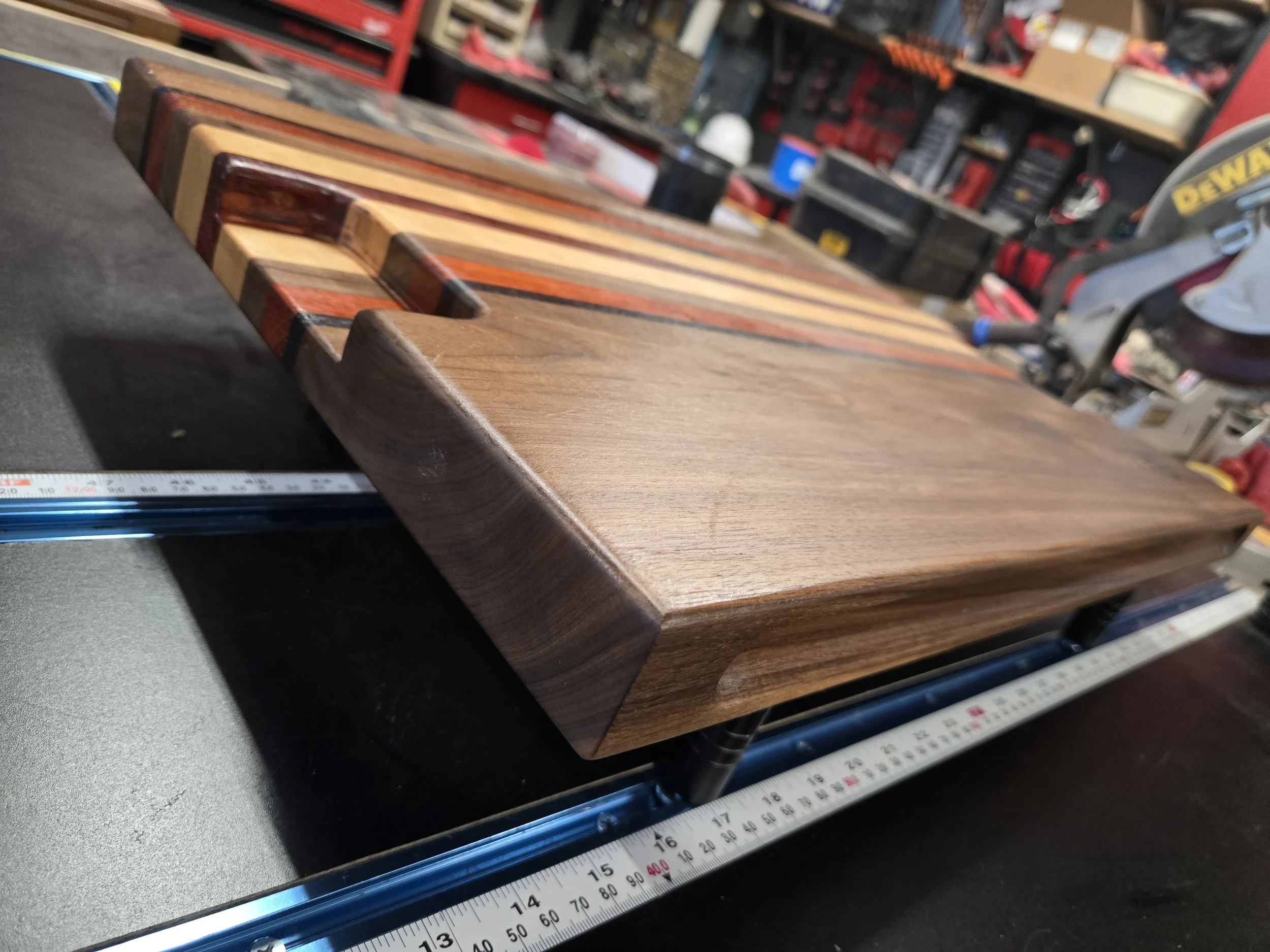 Custom cutting boards with various species of hard woods and all sealed with all-natural board butter. 