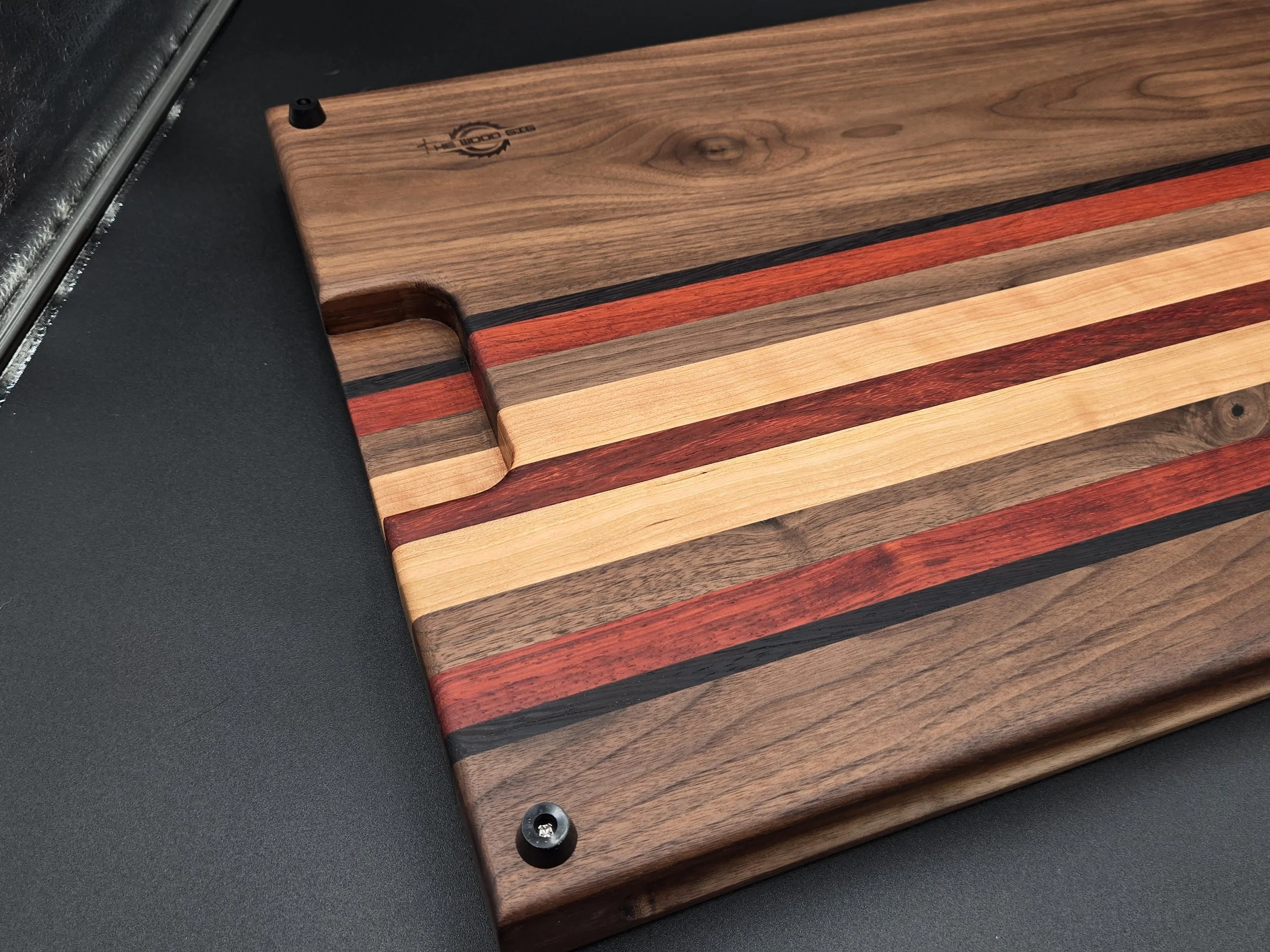 Custom cutting boards with various species of hard woods and all sealed with all-natural board butter.