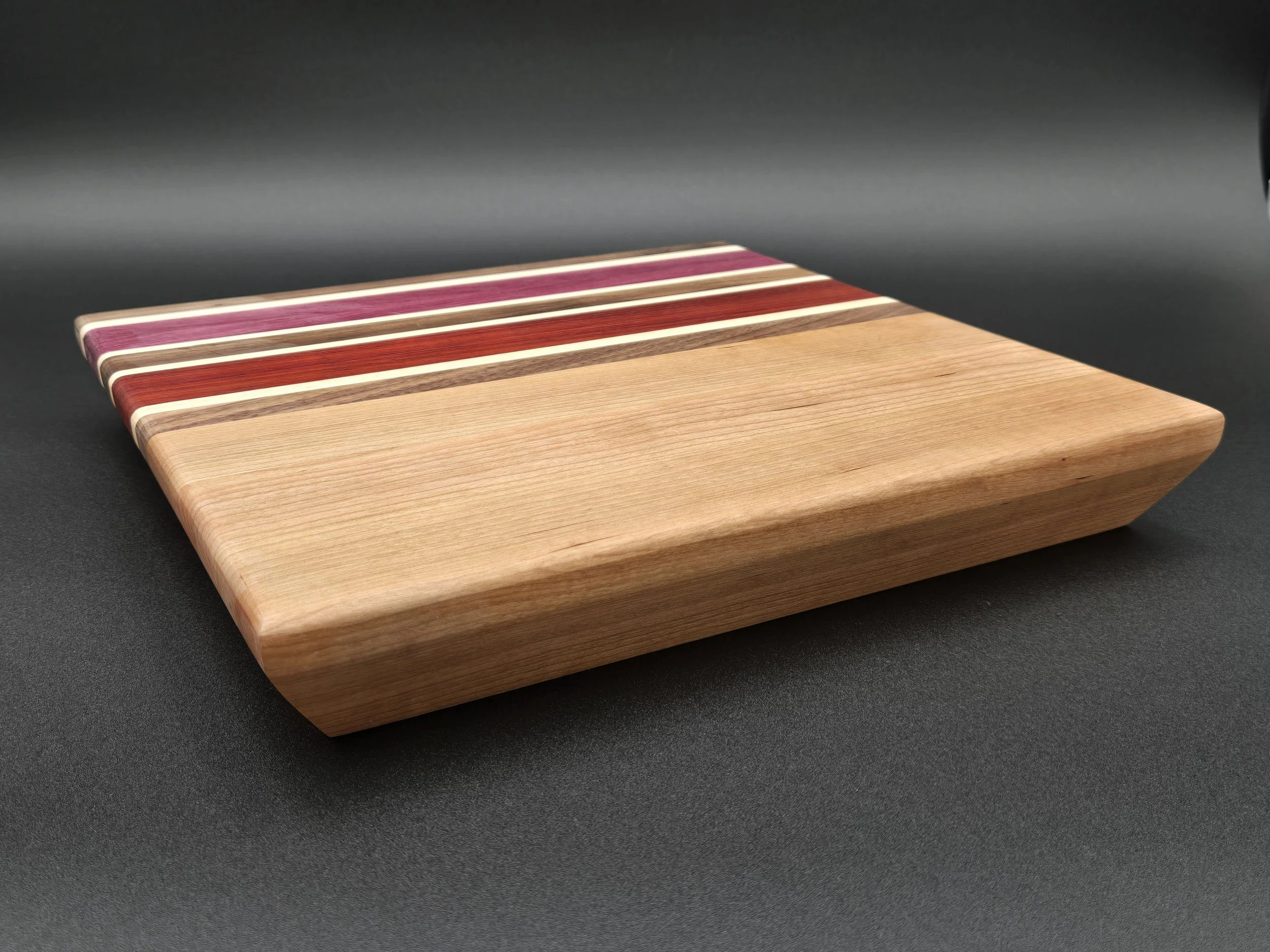 Custom cutting boards with various species of hard woods and all sealed with all-natural board butter. 