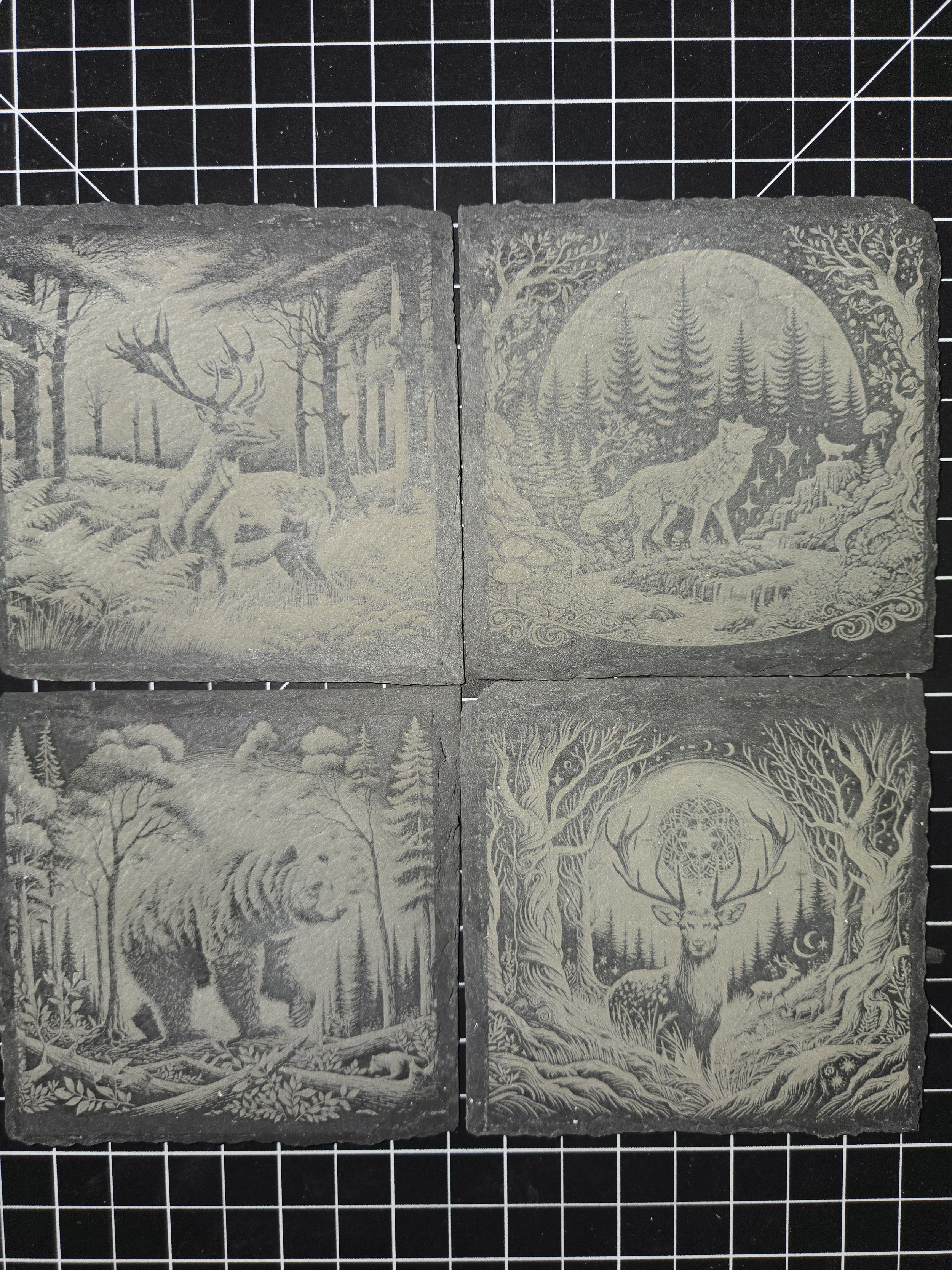 Four black and white illustrations of forest animals: a stag, a wolf, a bear, and a deer with antlers in a forest scene.