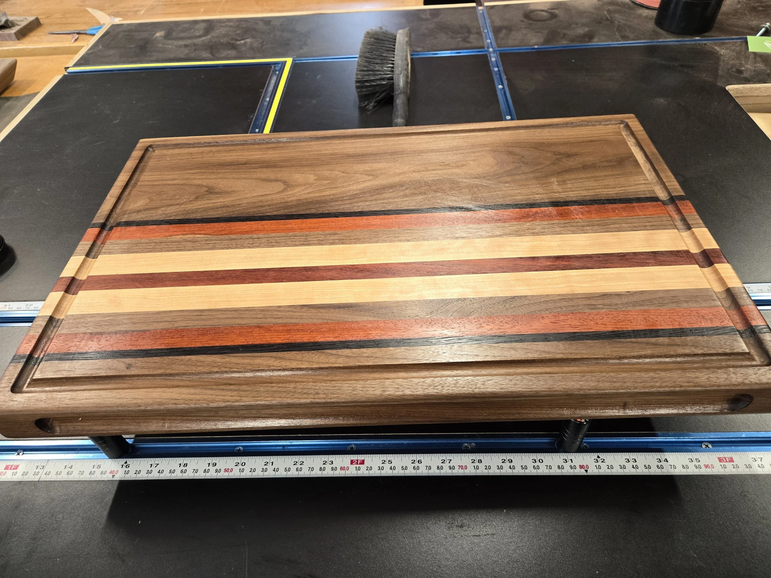 Custom cutting boards with various species of hard woods and all sealed with all-natural board butter. 