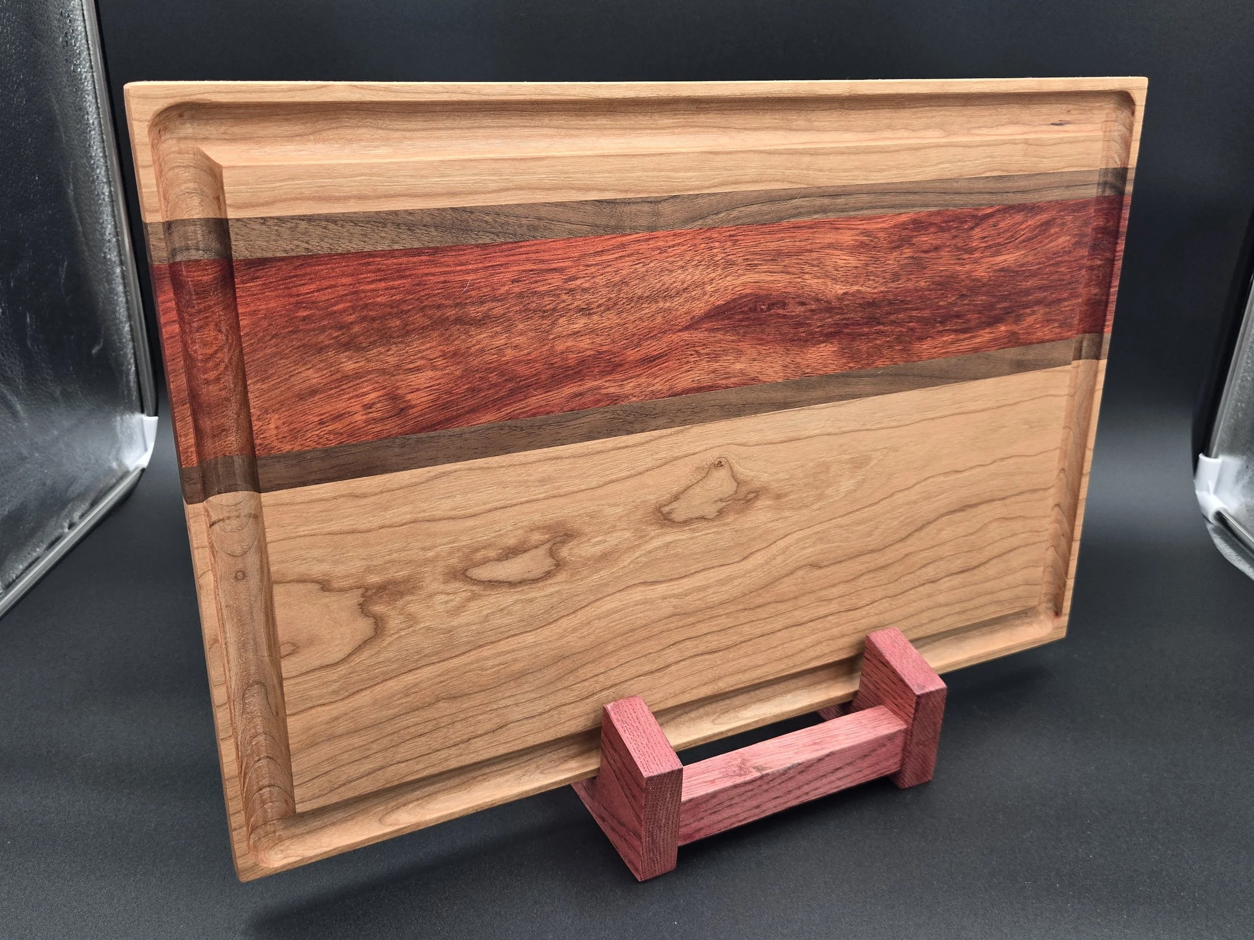 Custom cutting boards with various species of hard woods and all sealed with all-natural board butter.