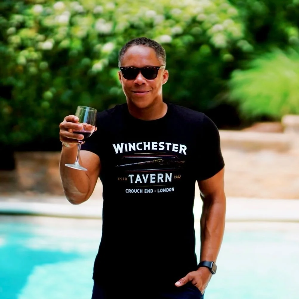 Photo of Earl Pinto raising a glass to the possiblity of working together