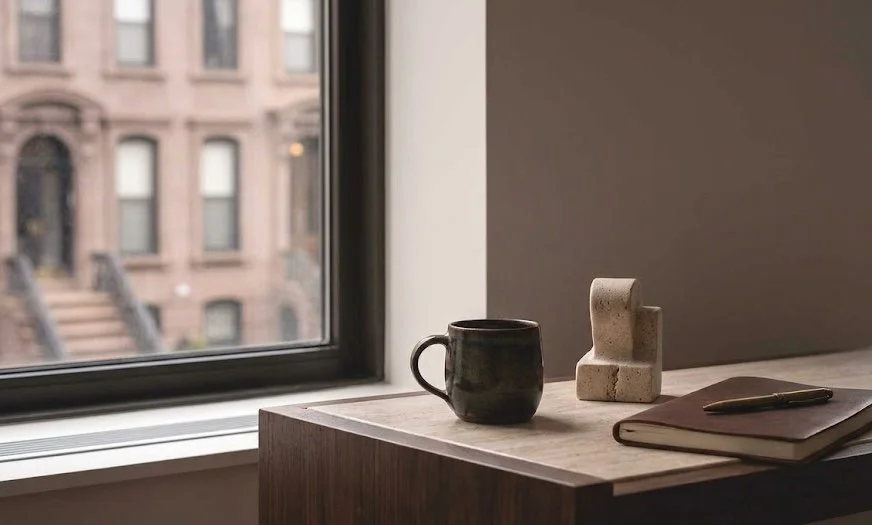 A quiet space for reflection featuring a notebook and professional decor in a Knots Counseling therapy office in NY.