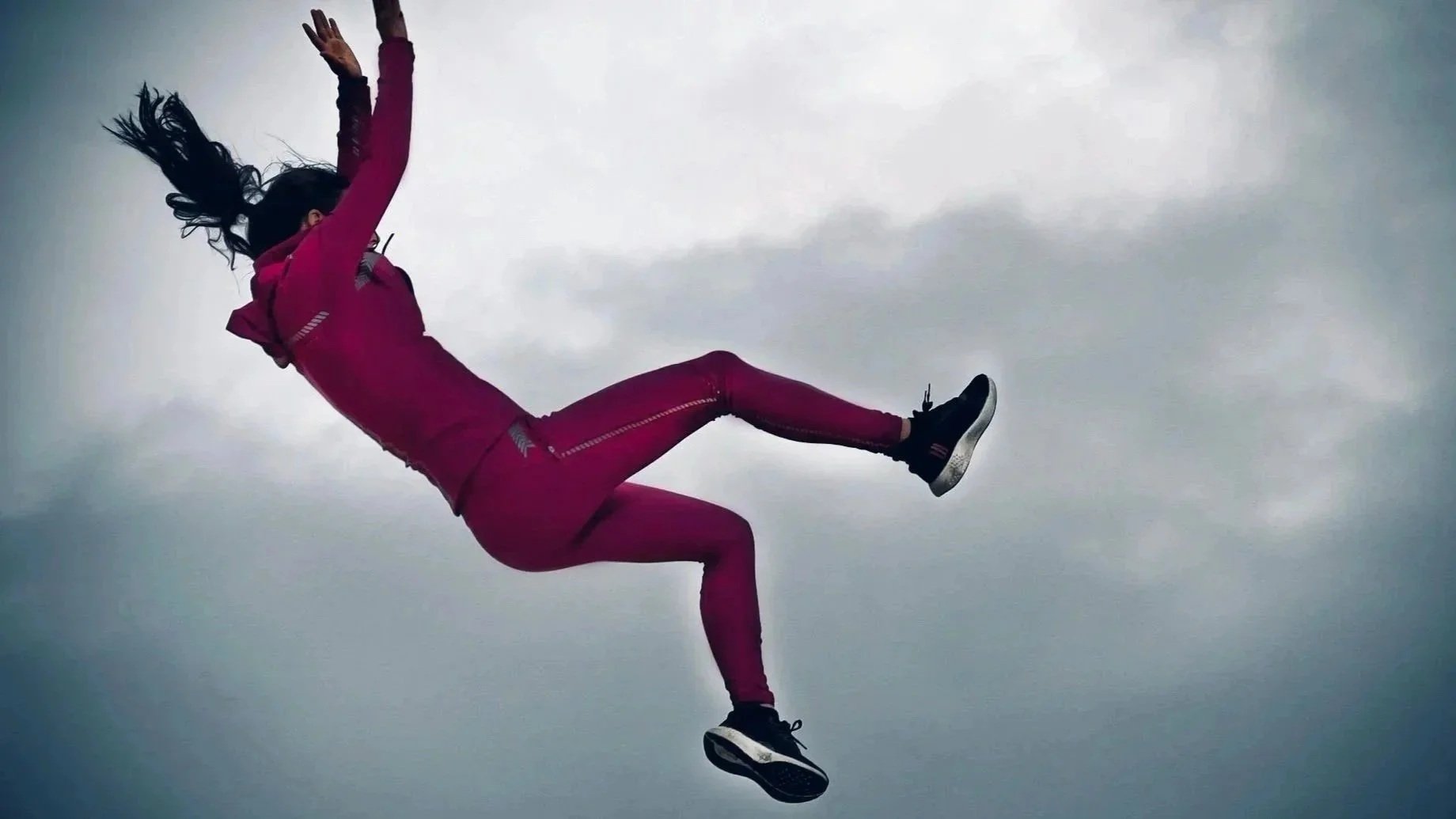 Angel Lia safely performing a high free fall stunt during filming for the movie Unseen.
