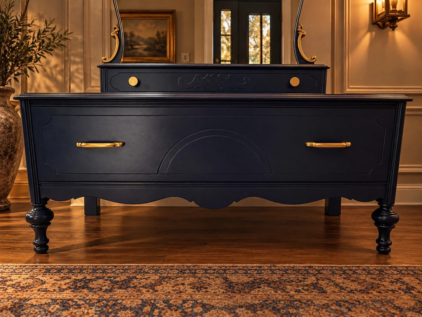 Front view of The Lune Noire Vanity featuring a wide lower storage drawer, decorative curved detailing, brass handles, and turned wooden legs.
