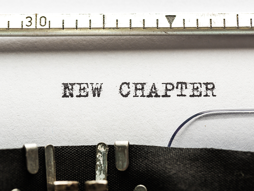 A typewriter typing "New Chapter"