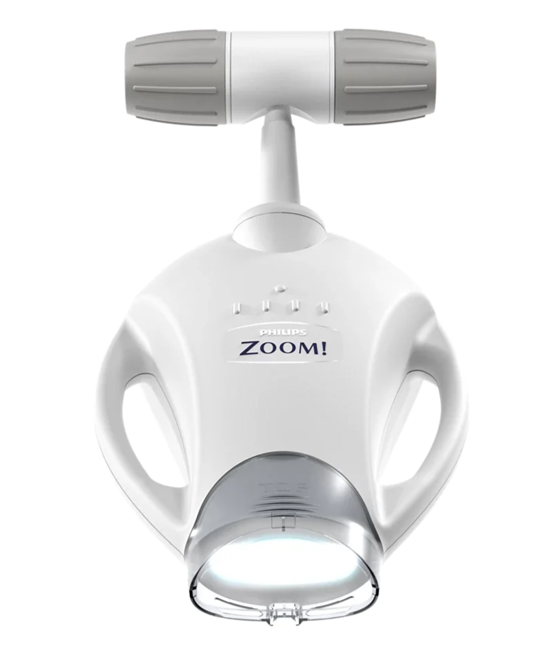 A Philips Zoom! dental curing light with a white handle and light-emitting end.