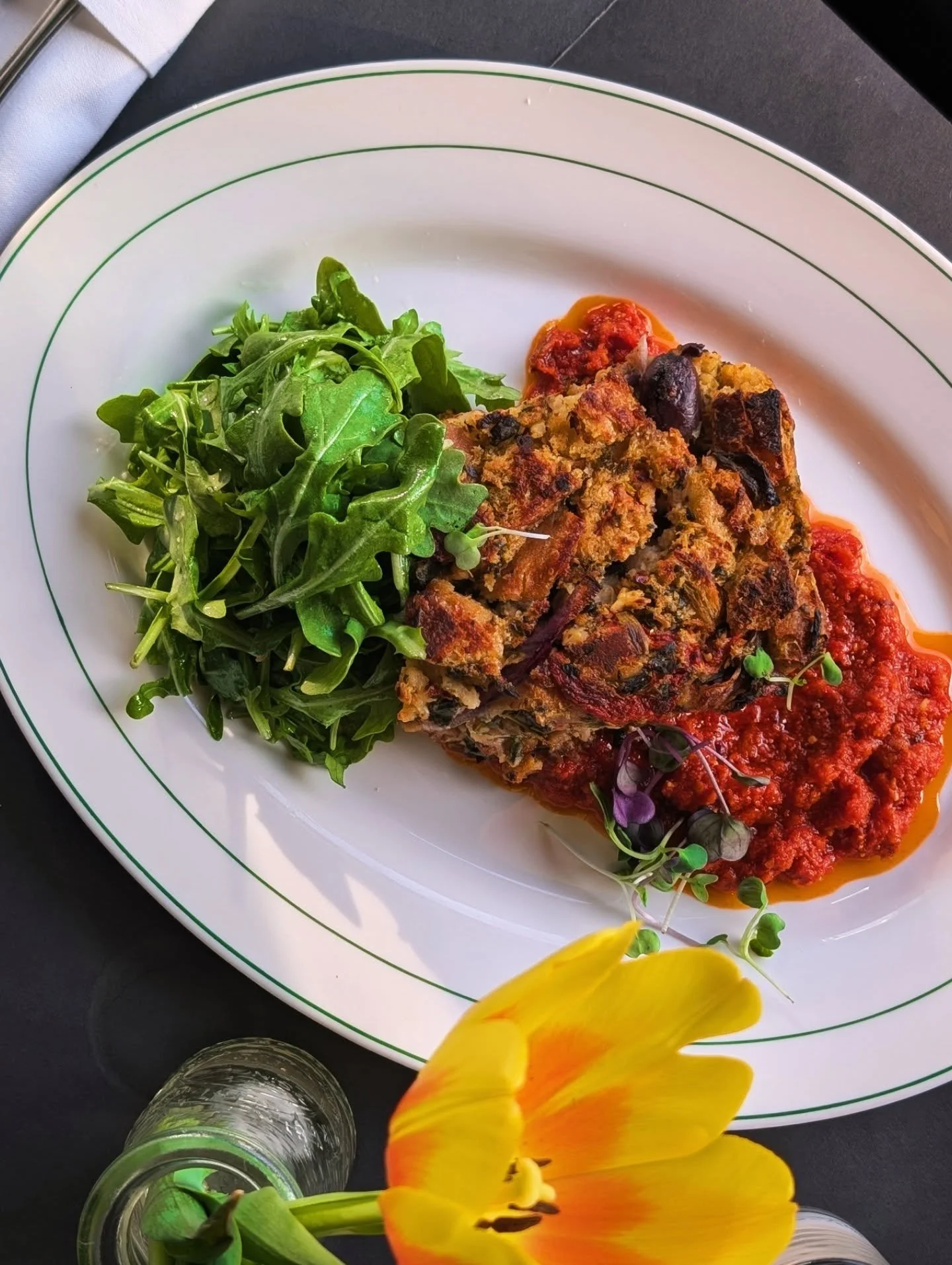 Savory Mediterranean Bread Pudding &bull; roasted red pepper, kalamata olive, feta, red onion, spinach, sun dried tomato pesto, dressed greens