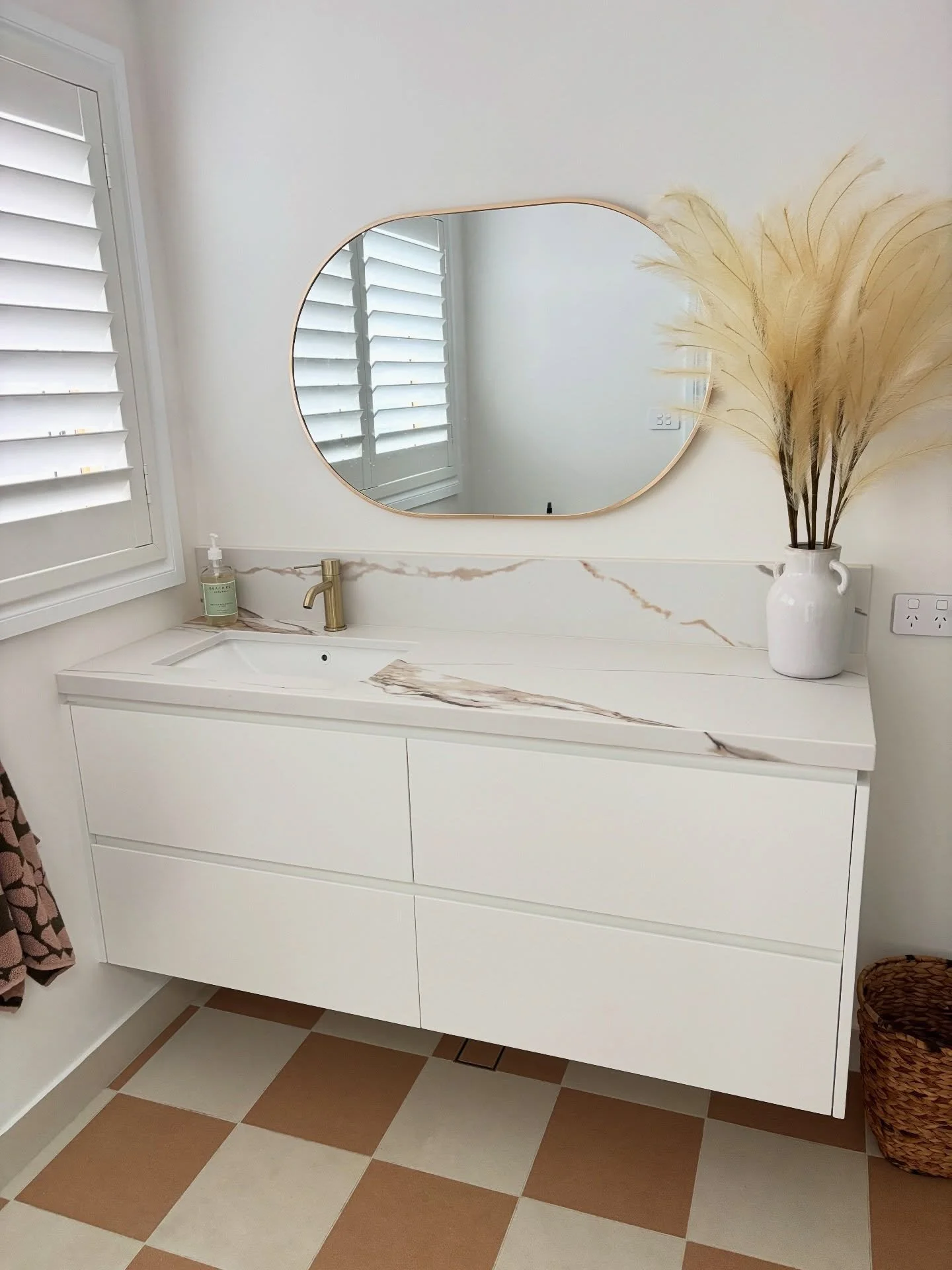 Bathroom vanity, The Junction. 

The design details:
- Angelico palazzo 40mm stone with splash back by @tops_in_stone 
- Shark nose handles 
- Painted drawer fronts @duluxaus lexicon quarter satin 
- Strip lighting underneath 
- @blumaustralia leggra
