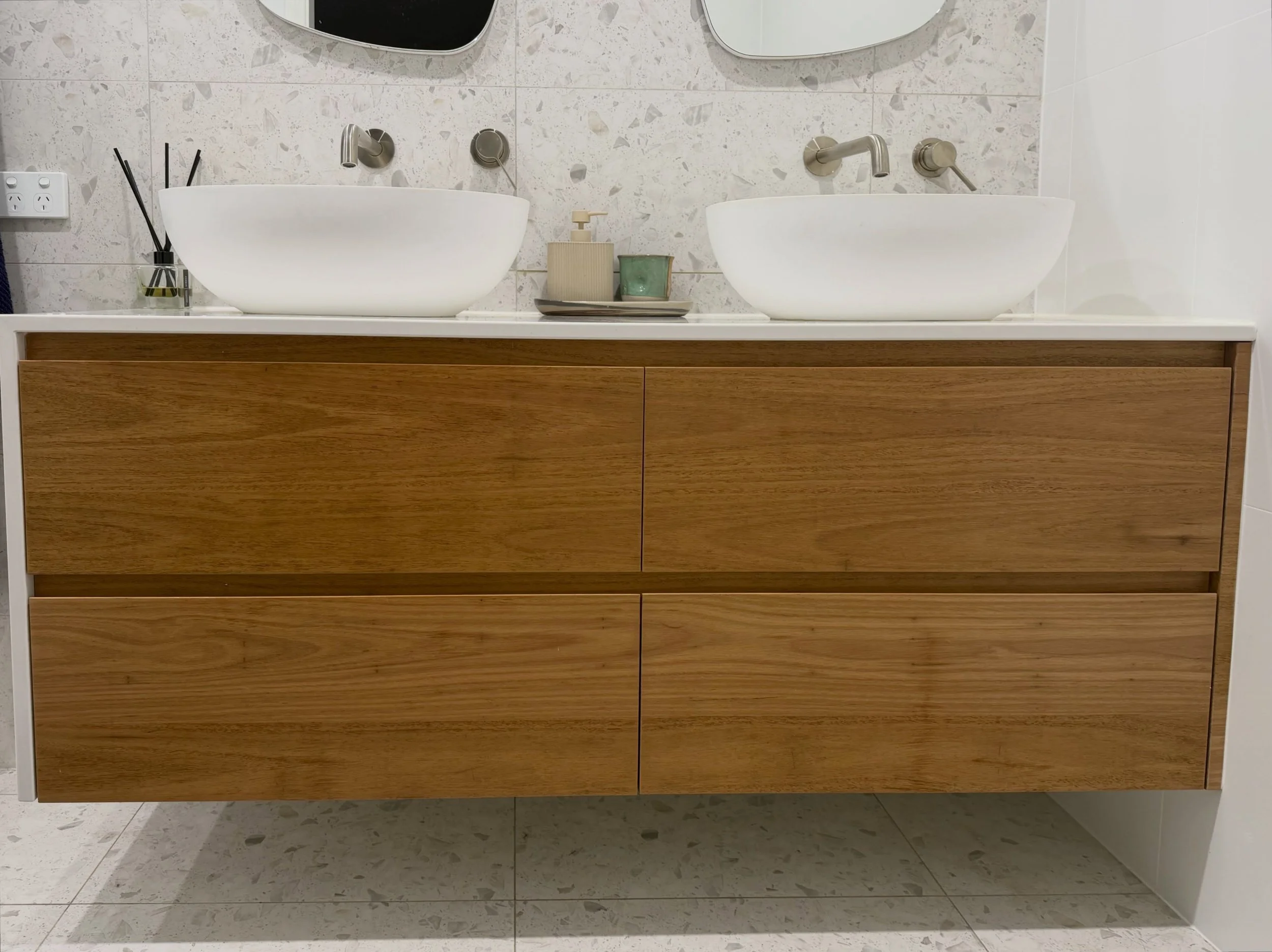 Merewether solid timber vanity 🚀 #joinery #bathroomdesign 

The details: 
- Blackbutt timber 
- Finger pull drawers 
- Stone bench top with waterfall end by @tops_in_stone