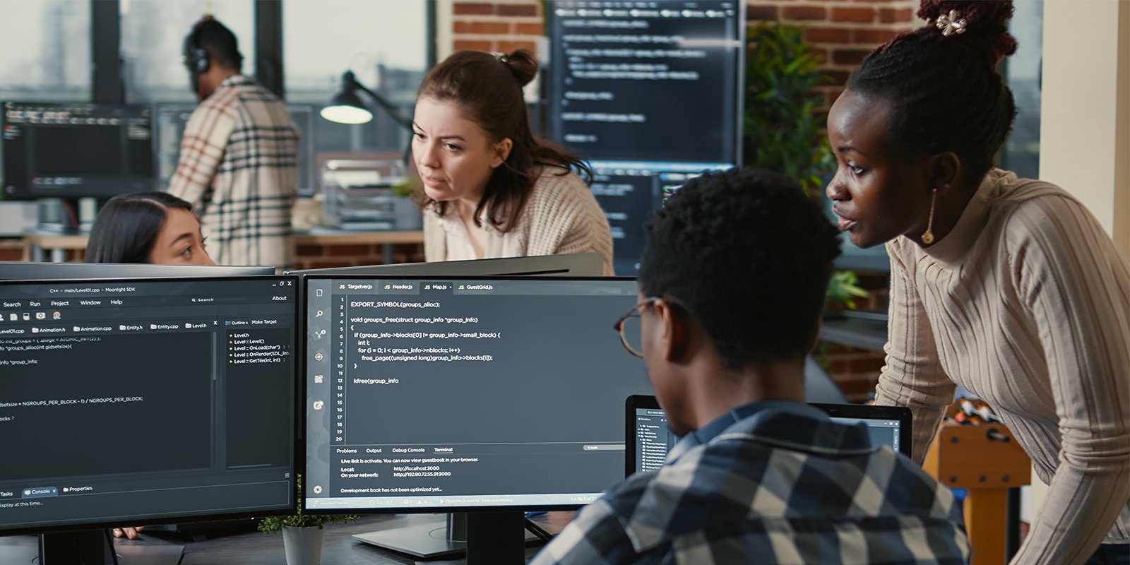 University students working together on game development and production