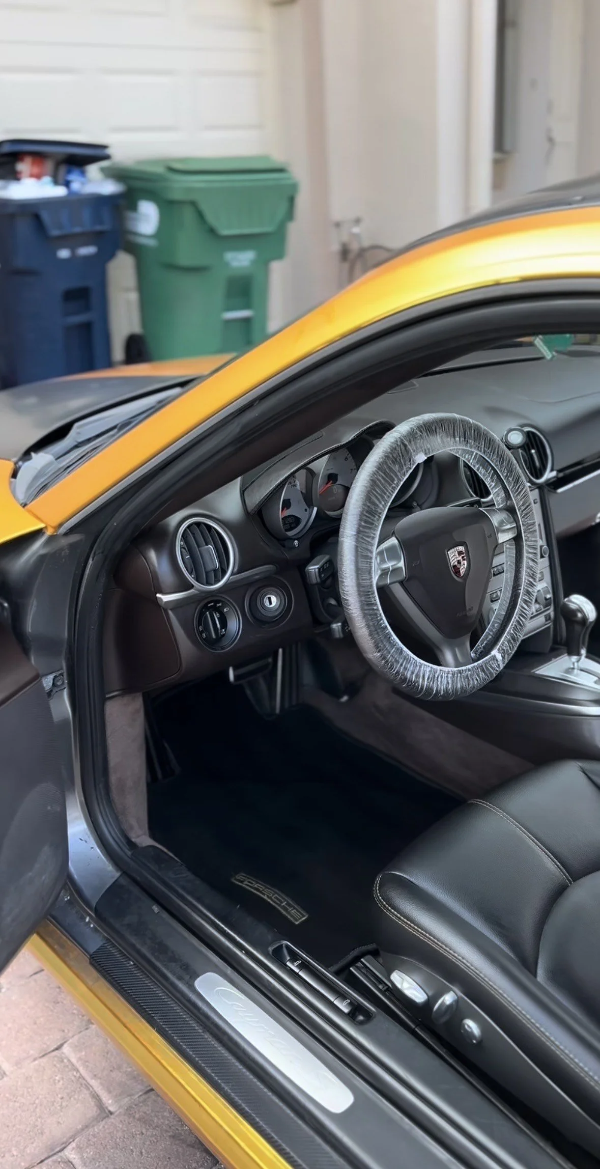 Interior of a yellow Porsche sports car after interior detail by Santos Car Care