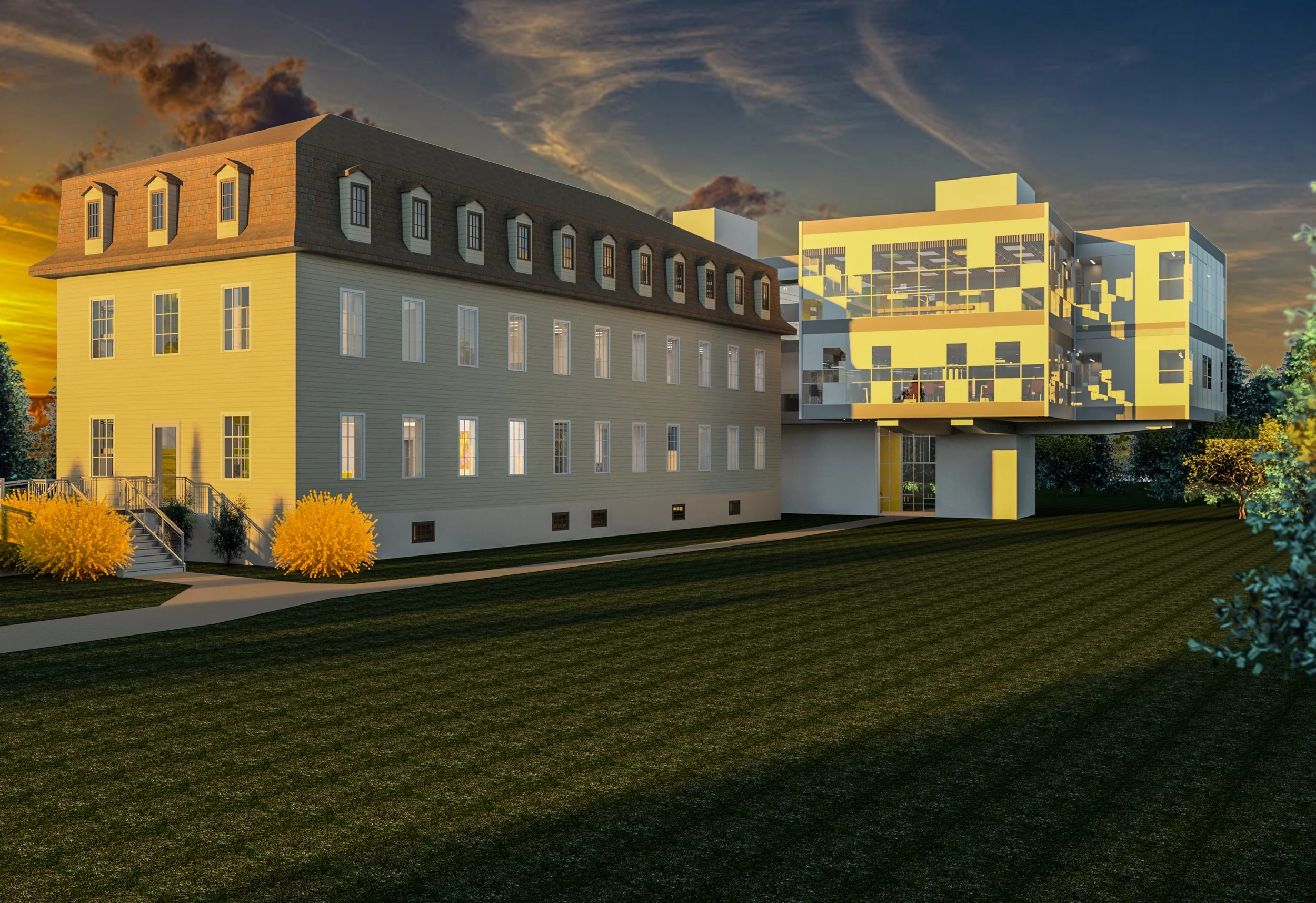 A modern building with glass balconies on a grassy area during sunset, with trees and orange-yellow bushes in the foreground.