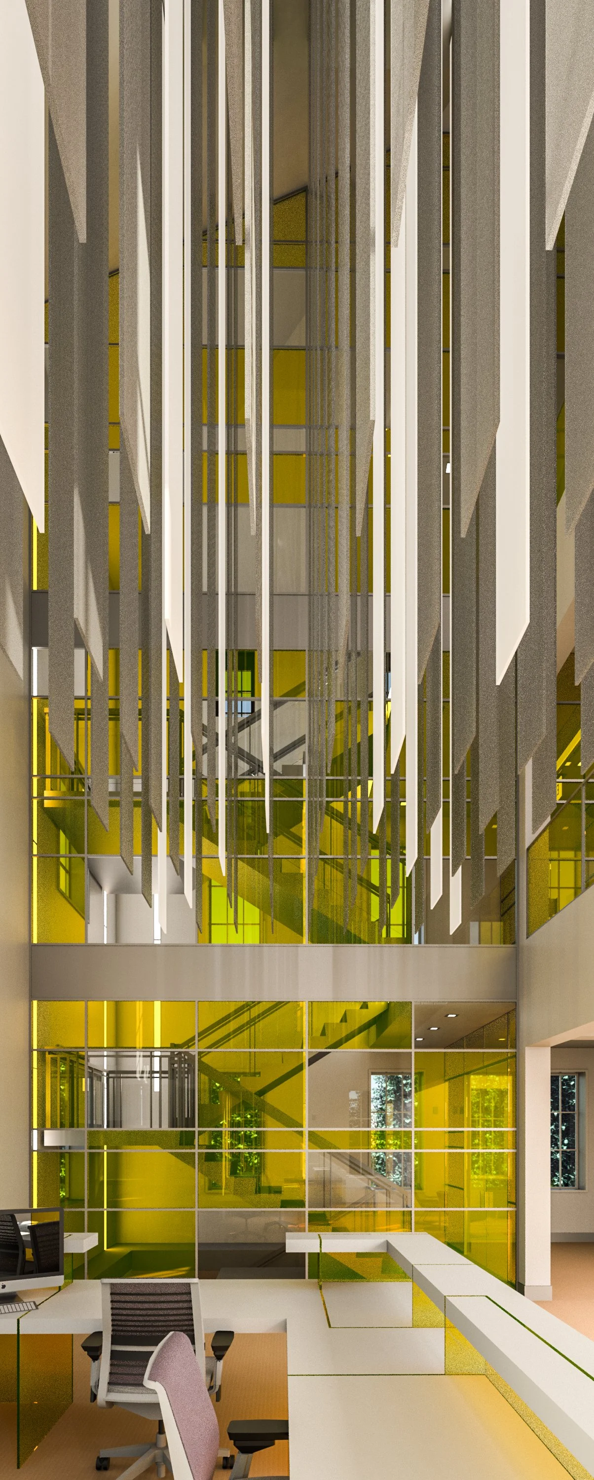 Interior of a modern building with a high ceiling, featuring hanging acoustic panels, glass walls with yellow tint, and a reception desk with office chairs.