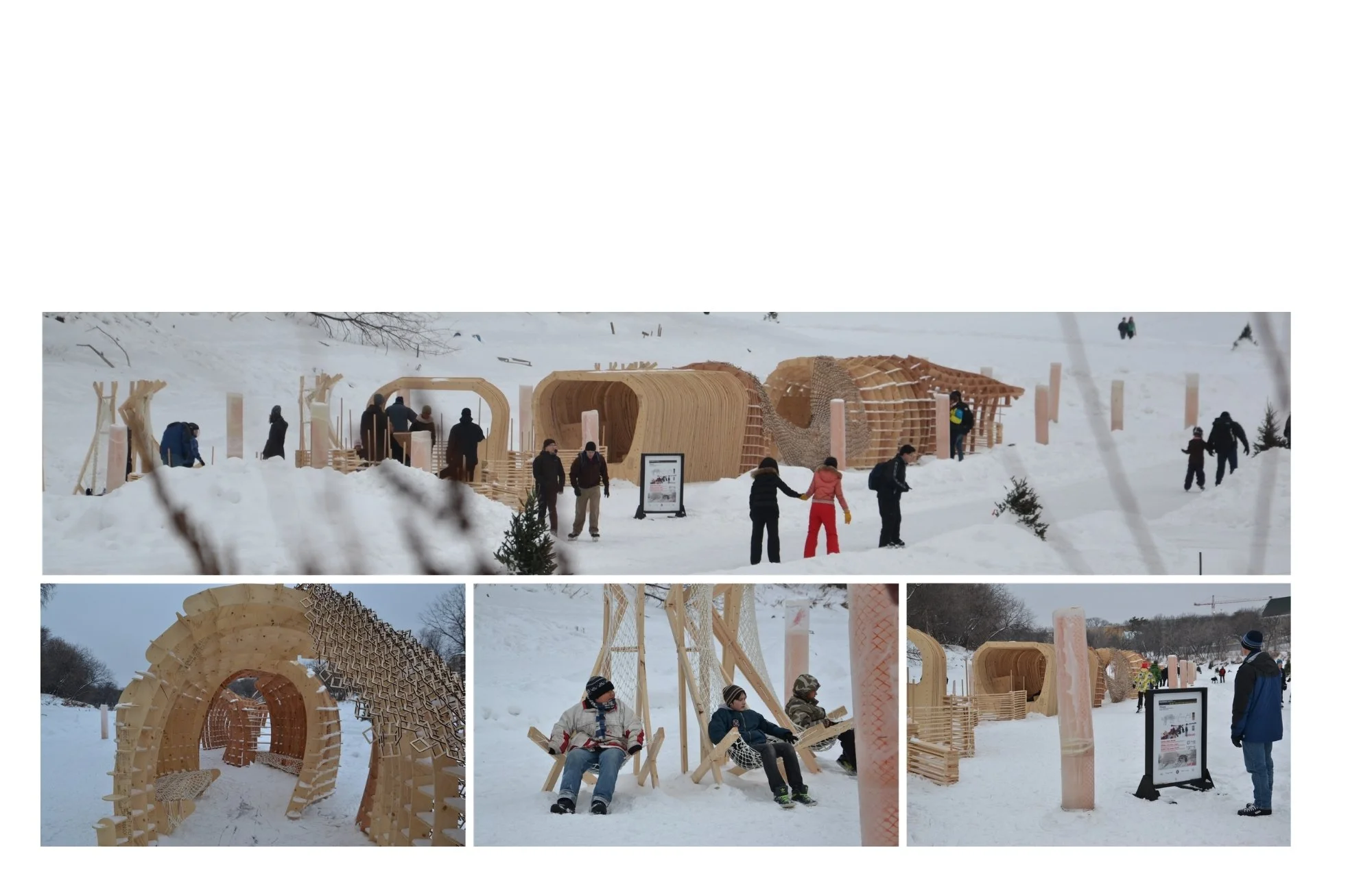 People explore a winter outdoor exhibit of wooden architectural structures and sculptures with snow-covered ground and trees in the background.