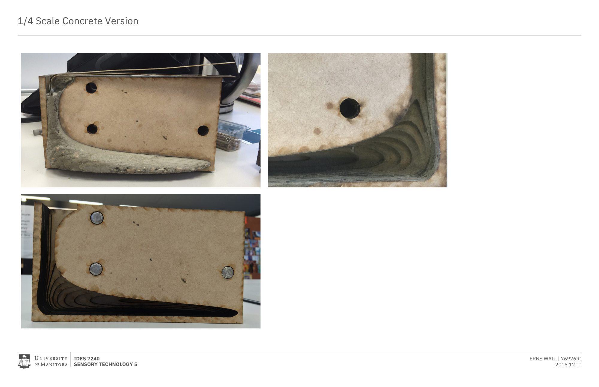 Photograph showing the underside of a quarter-scale concrete model, with visible holes, a black pipe opening, and curved layers of design, placed on a white surface in a laboratory or classroom setting.