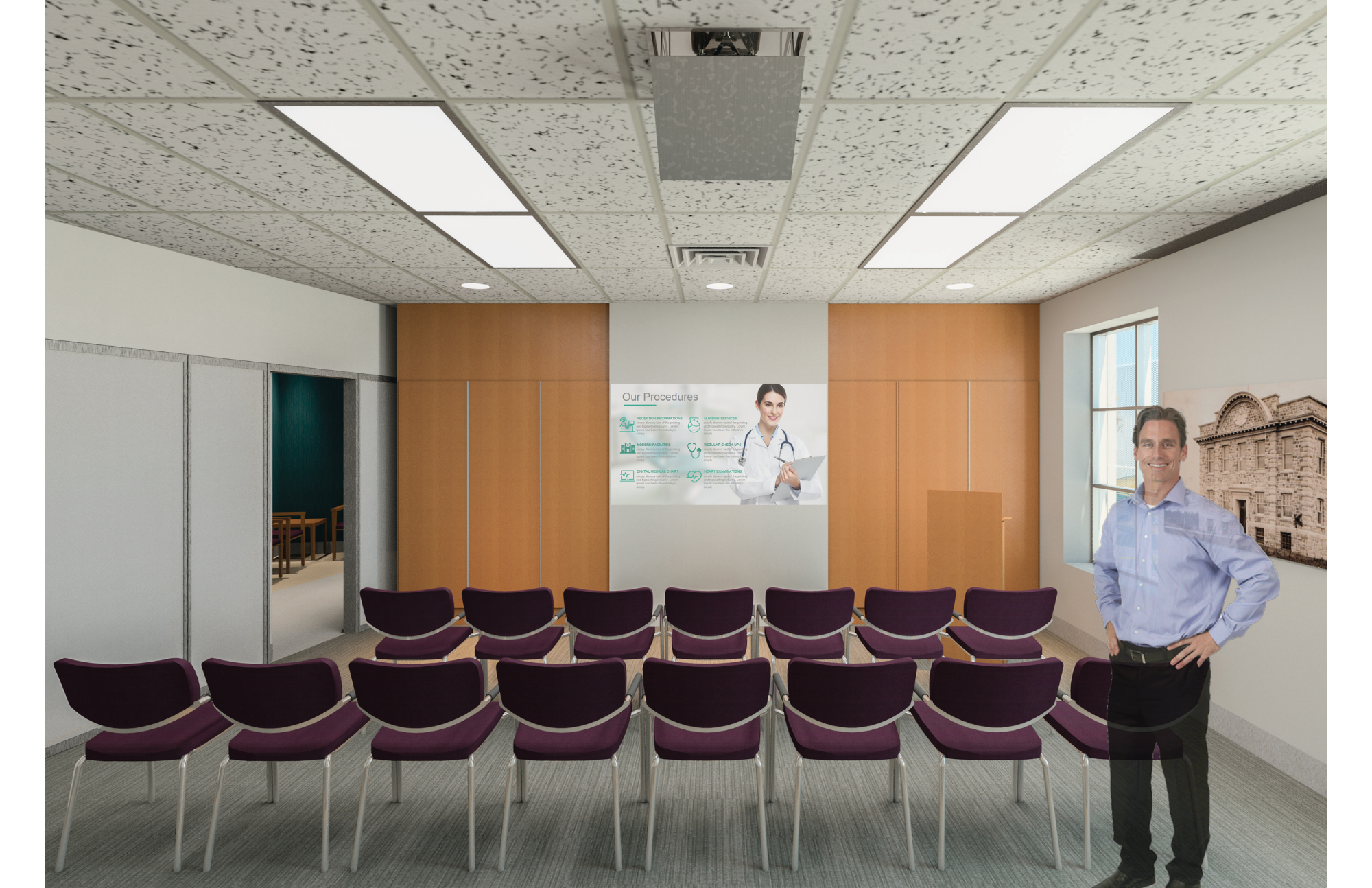 A conference room with maroon chairs arranged in rows, a wood-paneled wall with a medical procedures poster, and a man in a blue shirt standing near a window with a cityscape view. The ceiling has a textured pattern with rectangular lights and ventil