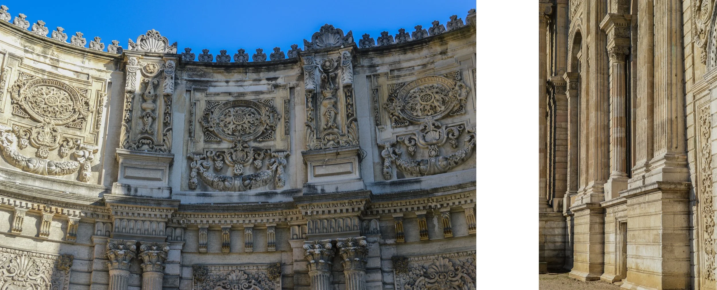 Close-up of ornate stone architectural details on a historic building, featuring intricate carvings, columns, and decorative elements with a blue sky background.