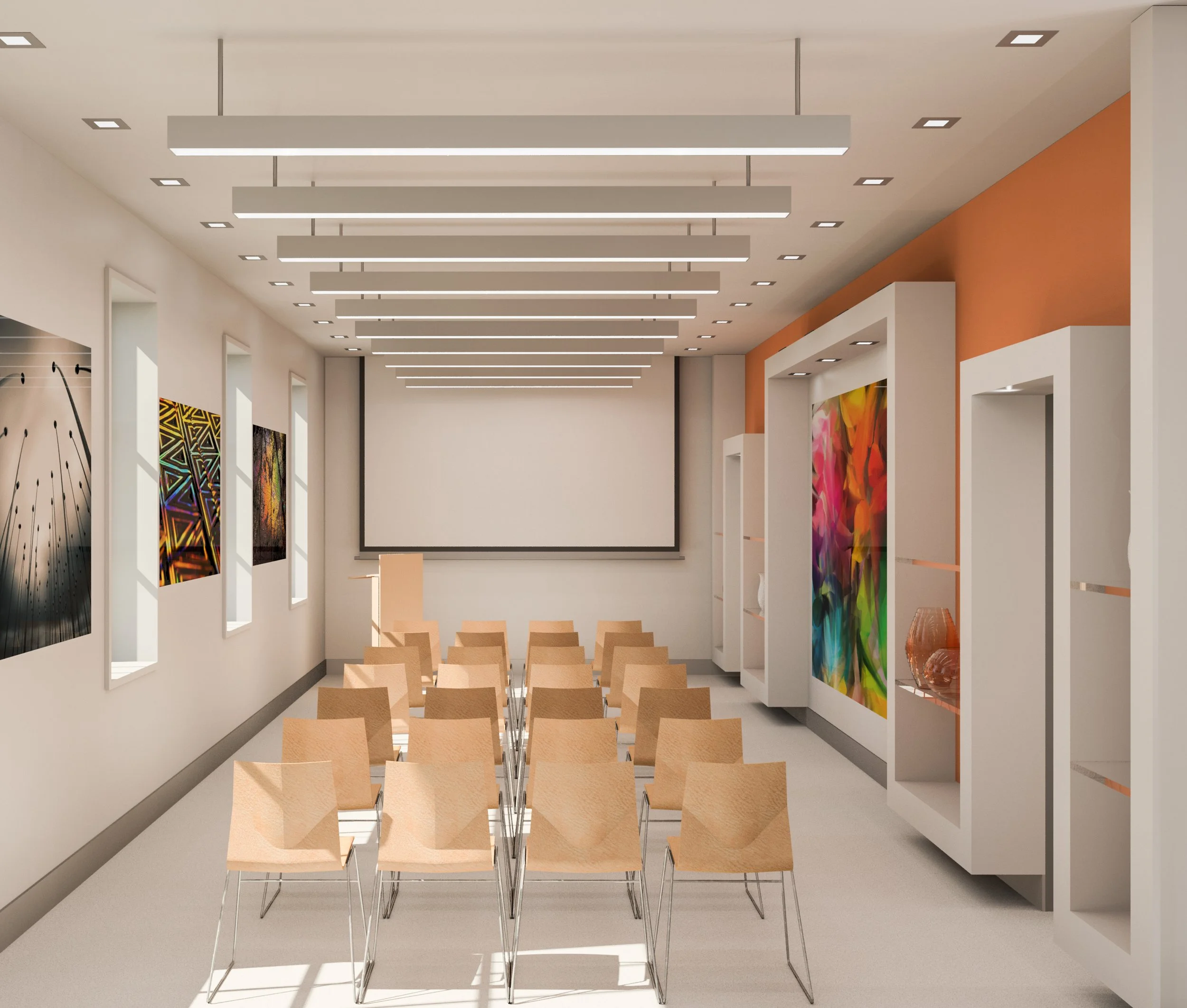 An art gallery or museum interior with white walls, colorful artwork, small chairs arranged in rows facing a blank wall, and modern lighting fixtures on the ceiling.