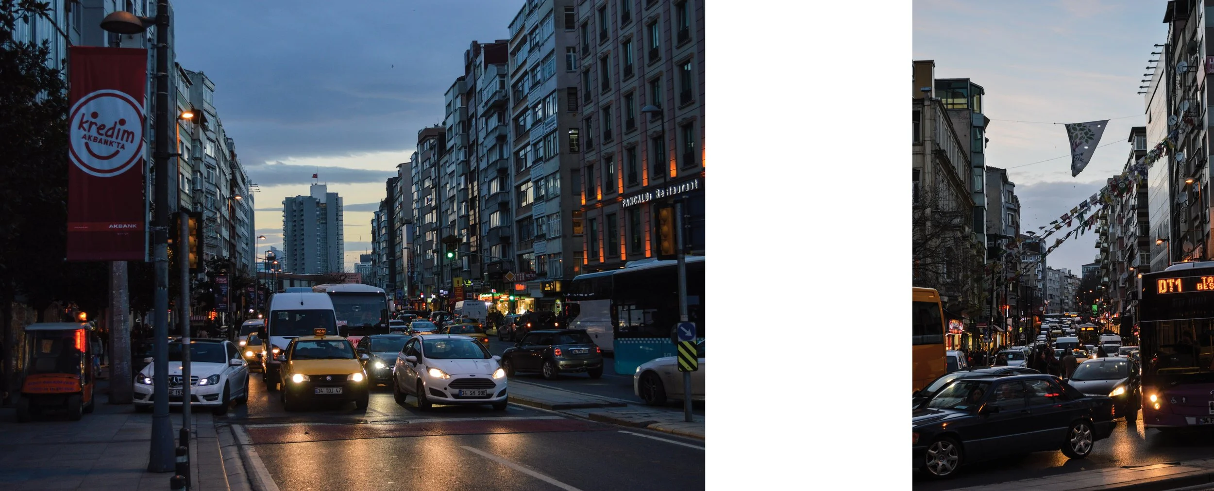 A city street at dusk with cars, buildings, streetlights, and decorative banners.