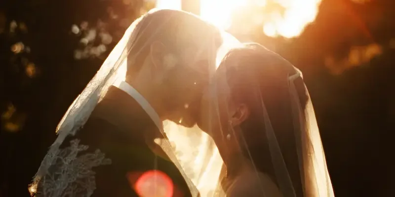 German destination wedding in Sicily featuring Anna-Maria and Rocco sharing a golden hour kiss after their ceremony at the Duomo di San Giorgio in Ragusa Ibla and reception at Villa Fegotto.