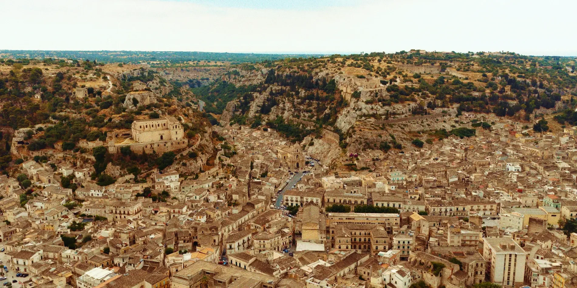 Destination wedding in Scicli Sicily, baroque street Via Mormino Penna at golden hour, luxury wedding film by Film Vision