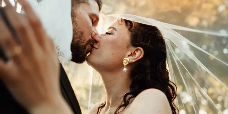 Bride and groom Anna-Maria and Rocco during a golden hour portrait session at Villa Fegotto after their destination wedding in Sicily.