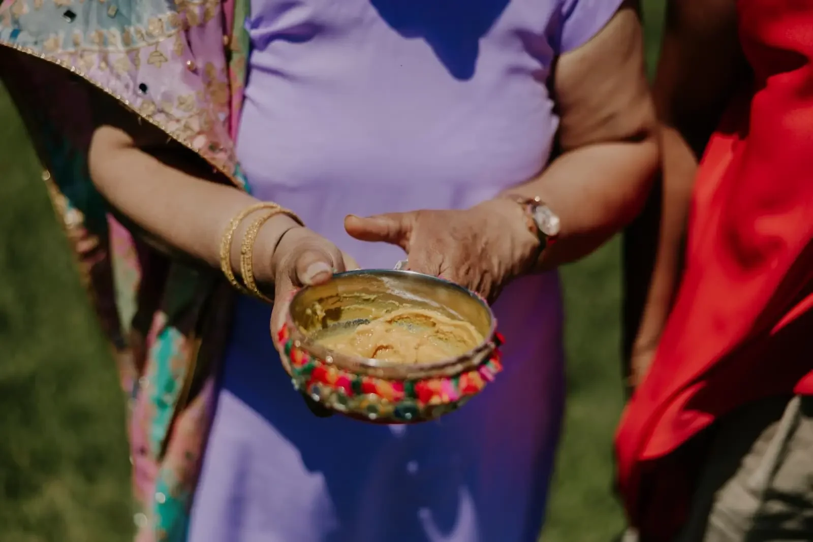 Bowl of turmeric paste used during the traditional Haldi ceremony at a luxury Hindu destination wedding in Sicily, Italy.