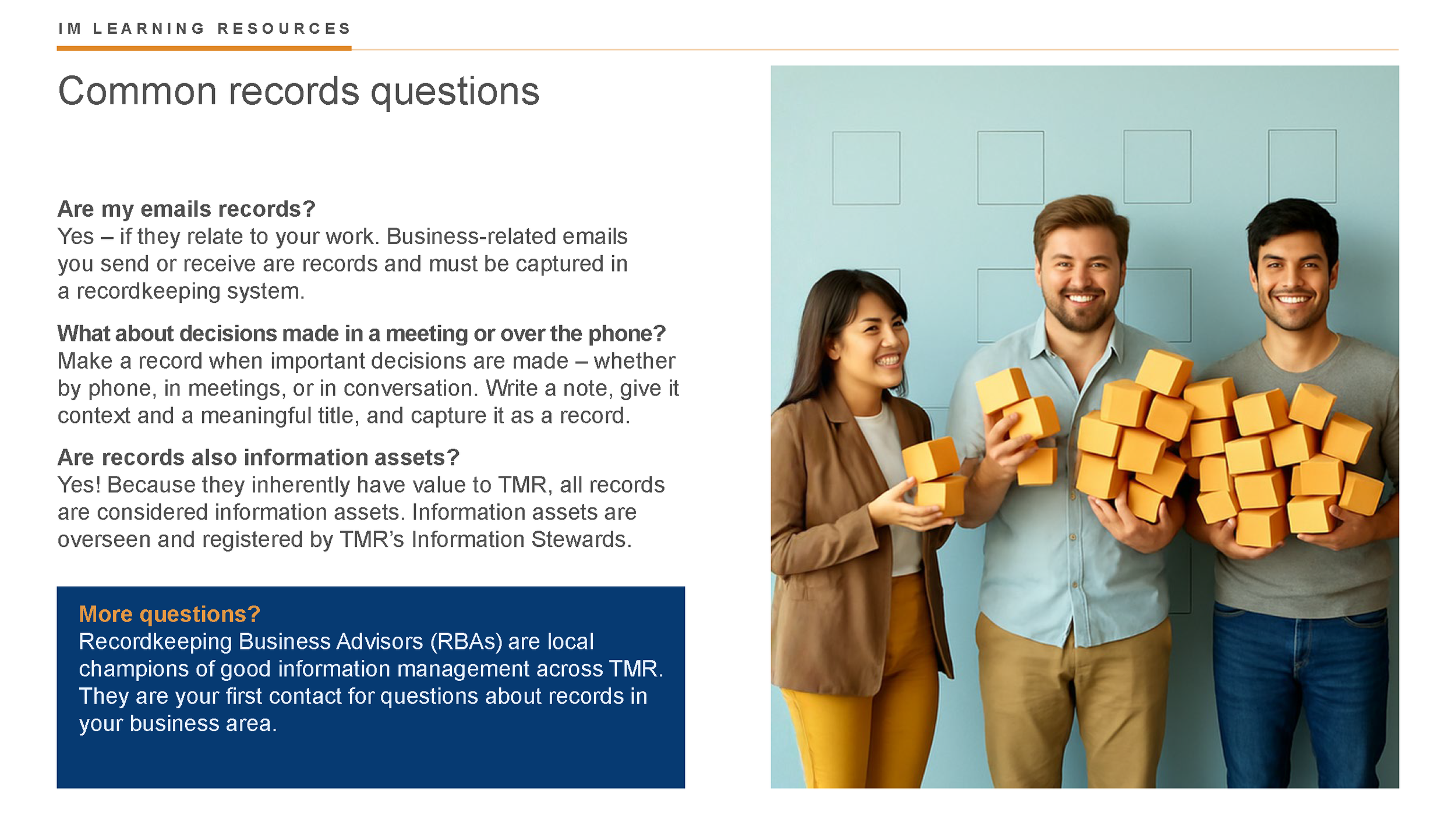 Three smiling people holding orange foam cubes standing against a light blue background with a schedule grid. The person on the left is a woman with dark hair wearing a brown blazer and yellow pants. The person in the middle is a man with a beard wearing a light blue shirt and beige pants. The person on the right is a man with dark hair wearing a gray shirt and blue jeans.