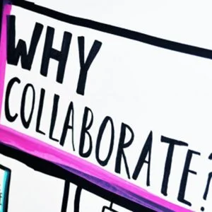 Close-up of a whiteboard with the question 'Why collaborate?' written in bold black letters, with pink accents.